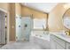 Beautiful bathroom featuring glass enclosed shower, soaking tub, double vanity and luxury finishes at 4223 Millside Se Walk, Smyrna, GA 30080
