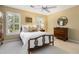 Cozy bedroom with shuttered windows, wooden furniture, and a ceiling fan that makes you want to stay at 4223 Millside Se Walk, Smyrna, GA 30080