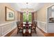 Formal dining room with a large table, elegant chandelier, and tray ceiling at 4223 Millside Se Walk, Smyrna, GA 30080