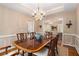 Elegant dining room featuring a wood table and decorative chandelier, perfect for Gathering gatherings at 4223 Millside Se Walk, Smyrna, GA 30080