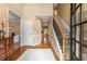 Elegant foyer with hardwood floors, staircase, and decorative details at 4223 Millside Se Walk, Smyrna, GA 30080