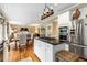 Open kitchen with a granite island, stainless steel appliances, and hardwood floors at 4223 Millside Se Walk, Smyrna, GA 30080