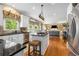 Bright kitchen with stainless steel appliances, white cabinets, and a breakfast bar at 4223 Millside Se Walk, Smyrna, GA 30080