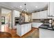 Bright, open kitchen featuring a central island, stainless appliances, and hardwood floors at 4223 Millside Se Walk, Smyrna, GA 30080