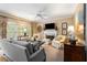 Cozy living room with a fireplace, plush seating, and large windows at 4223 Millside Se Walk, Smyrna, GA 30080