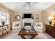 Cozy living room with neutral tones, fireplace, ceiling fan and abundant natural light at 4223 Millside Se Walk, Smyrna, GA 30080