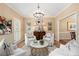 Comfortable seating arrangement under a stylish chandelier with bright natural light at 4223 Millside Se Walk, Smyrna, GA 30080