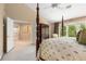 Bright and airy main bedroom with a four-poster bed with access to the en-suite bathroom at 4223 Millside Se Walk, Smyrna, GA 30080