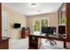 Dedicated home office space with a large desk, ample natural light, and built in storage at 4223 Millside Se Walk, Smyrna, GA 30080