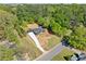 Expansive aerial view of home with long driveway, set amongst mature trees on a large lot at 5017 Spring Hill Dr, Sugar Hill, GA 30518
