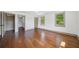 Spacious bedroom featuring hardwood floors and ensuite access to a walk-in closet at 5017 Spring Hill Dr, Sugar Hill, GA 30518