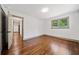 Bedroom with hardwood floors and natural light at 5017 Spring Hill Dr, Sugar Hill, GA 30518