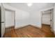 Bedroom with hardwood floors and two closet spaces at 5017 Spring Hill Dr, Sugar Hill, GA 30518