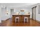 Bright kitchen featuring a large island, stainless appliances, hardwood floors, and custom cabinets at 5017 Spring Hill Dr, Sugar Hill, GA 30518