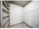 Walk-in pantry with ample shelving for organized storage at 5017 Spring Hill Dr, Sugar Hill, GA 30518