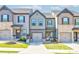 Charming townhomes featuring craftsman-style architecture and well-maintained landscaping at 7154 Sw Chara Sw Ln, Atlanta, GA 30331