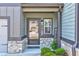 Inviting front entrance with brick accents and a glass-paneled door and a 'Welcome' sign at 7154 Sw Chara Sw Ln, Atlanta, GA 30331
