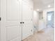 Bright hallway with white doors and carpeted floors at 7154 Sw Chara Sw Ln, Atlanta, GA 30331