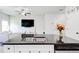 Open concept kitchen with an island sink, granite countertops, and a view into the living room at 7154 Sw Chara Sw Ln, Atlanta, GA 30331