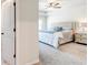 Spacious main bedroom with tray ceiling, soft carpet, and a queen-sized bed at 7154 Sw Chara Sw Ln, Atlanta, GA 30331