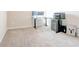 Spacious carpeted room with a desk setup and printer for a functional home office area at 7154 Sw Chara Sw Ln, Atlanta, GA 30331