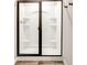 Modern shower stall with built-in shelving and a sleek glass door, offering a luxurious experience at 7154 Sw Chara Sw Ln, Atlanta, GA 30331