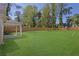 Large, private backyard featuring a well-manicured lawn and a tall wooden fence for added privacy at 1353 Midlawn Dr, Decatur, GA 30032