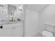 Stylish half-bathroom with a decorative mirror, modern vanity, and patterned floor tiles at 1353 Midlawn Dr, Decatur, GA 30032