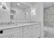 Stylish bathroom with double vanity, elegant marble countertops, decorative sconces, and a walk-in shower at 1353 Midlawn Dr, Decatur, GA 30032