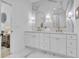 Bathroom featuring a double vanity, gold fixtures, and sleek, modern design at 1353 Midlawn Dr, Decatur, GA 30032