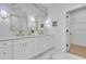 A bright bathroom offers double sinks, white cabinetry, and modern fixtures at 1353 Midlawn Dr, Decatur, GA 30032