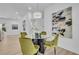 Modern dining area with seating for four and an artistic light fixture at 1353 Midlawn Dr, Decatur, GA 30032