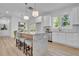 Bright kitchen with a marble island, stainless appliances, and access to the dining area at 1353 Midlawn Dr, Decatur, GA 30032