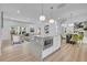 Open floor plan with kitchen island, dining area, and living room at 1353 Midlawn Dr, Decatur, GA 30032