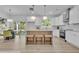 Eat-in kitchen featuring white cabinets, stainless steel appliances, and a center island at 1353 Midlawn Dr, Decatur, GA 30032
