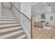 Bright, open floor plan with staircase featuring wood treads and white risers at 1353 Midlawn Dr, Decatur, GA 30032