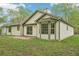 Charming backyard featuring a brick patio, perfect for outdoor gatherings and relaxation, surrounded by green space at 3719 Bomar Rd, Douglasville, GA 30135