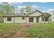 Spacious backyard featuring a well-maintained lawn and the home's exterior at 3719 Bomar Rd, Douglasville, GA 30135