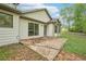 Home's backyard with a patio and a view of the lush green lawn at 3719 Bomar Rd, Douglasville, GA 30135