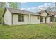 Exterior of home featuring lawn and green foliage in the background at 3719 Bomar Rd, Douglasville, GA 30135
