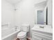 This bathroom features a white bathtub and a white vanity at 3719 Bomar Rd, Douglasville, GA 30135