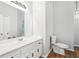 This bathroom features a white vanity with marble countertop at 3719 Bomar Rd, Douglasville, GA 30135