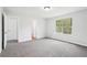 This bedroom has gray walls, carpet flooring, and a window at 3719 Bomar Rd, Douglasville, GA 30135