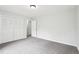 This bedroom has gray walls, carpet flooring, and a double door closet at 3719 Bomar Rd, Douglasville, GA 30135