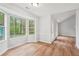 Inviting dining room with chair rail, hardwood floors, and natural light from a large window at 3719 Bomar Rd, Douglasville, GA 30135