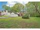 Single-story home with attached garage, brick accent window, and large front yard at 3719 Bomar Rd, Douglasville, GA 30135