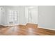 Bright foyer with hardwood floors, white trim, and double French doors at 3719 Bomar Rd, Douglasville, GA 30135