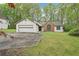 Charming single-story home with a two-car garage, brick accent, and a well-maintained front lawn at 3719 Bomar Rd, Douglasville, GA 30135