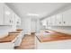 Spacious eat-in kitchen with wood countertops, white cabinets, hardwood flooring, and stainless steel sink at 3719 Bomar Rd, Douglasville, GA 30135