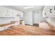 Spacious eat-in kitchen with wood countertops, white cabinets, hardwood flooring, and stainless steel sink at 3719 Bomar Rd, Douglasville, GA 30135